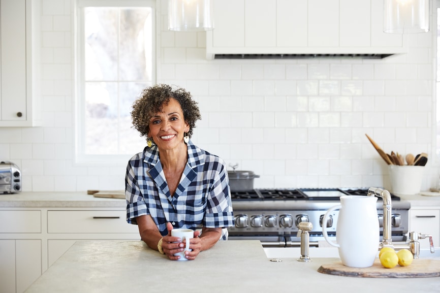 woman in kitchen with drink