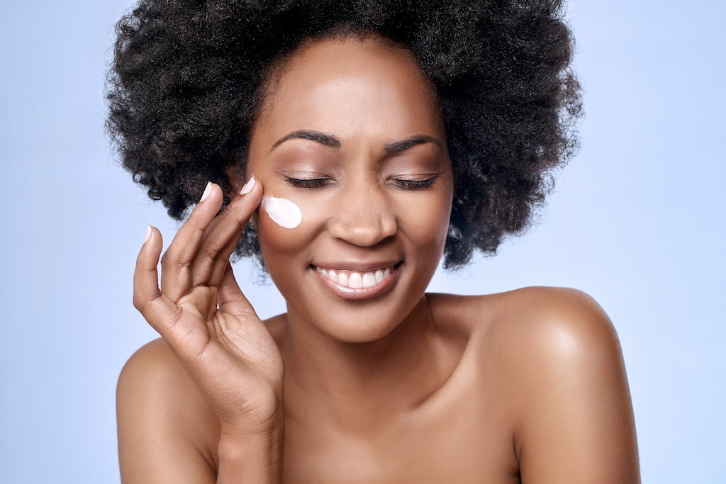 Woman Applying Sunscreen