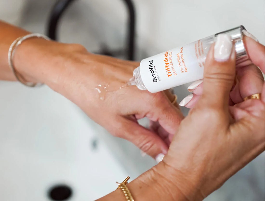 Woman applying TriHydrate hyaluronic acid on her hand