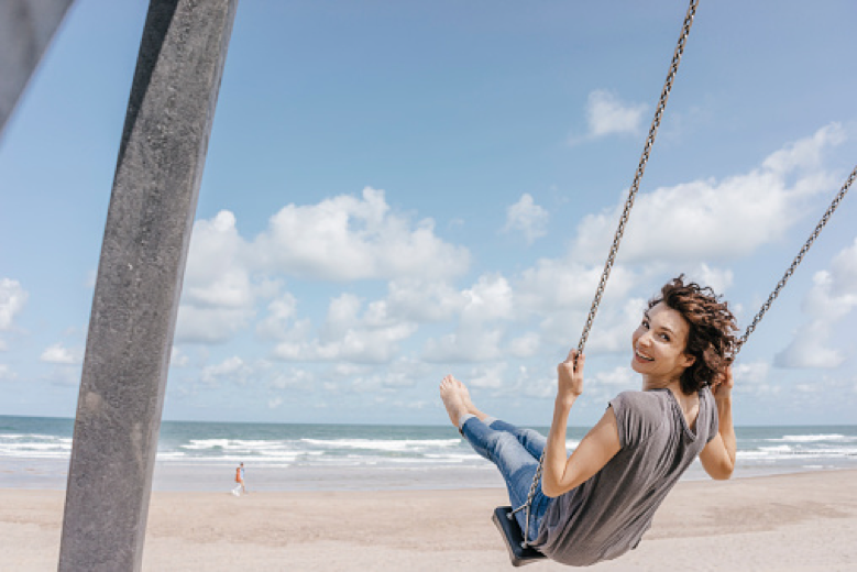 woman living life swinging