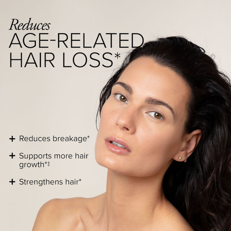 A woman with beautiful, long brunette hair looking directly into the camera with text showing Hair Regeneres reduces breakage and supports more hair growth