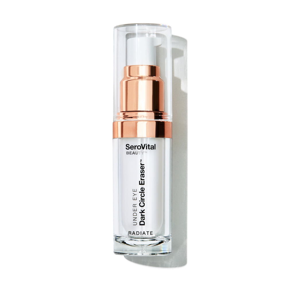 A white and rose gold pump bottle of SeroVital Beauty Dark Circle Eraser sits vertically against a white background, casting a slight shadow to its right.