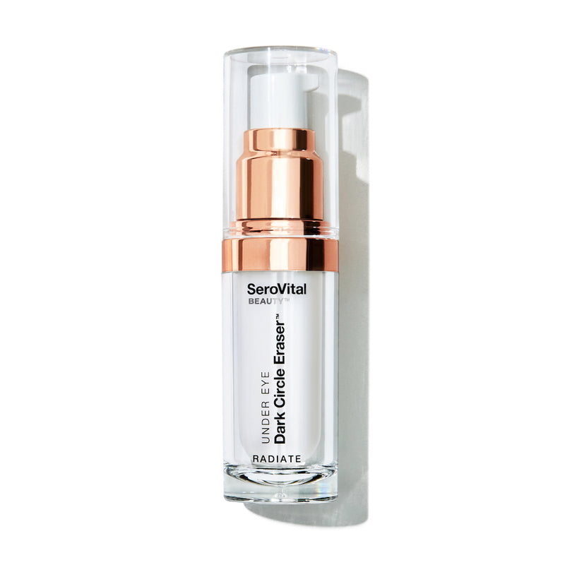 A white and rose gold pump bottle of SeroVital Beauty Dark Circle Eraser sits vertically against a white background, casting a slight shadow to its right.