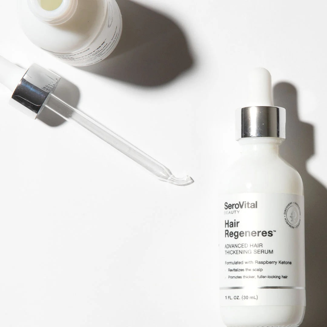 Still-life product shot of SeroVital Hair Regeneres serum bottle and dropper on white background.