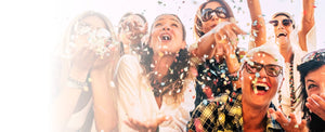 Group of people celebrating with confetti in a festive setting