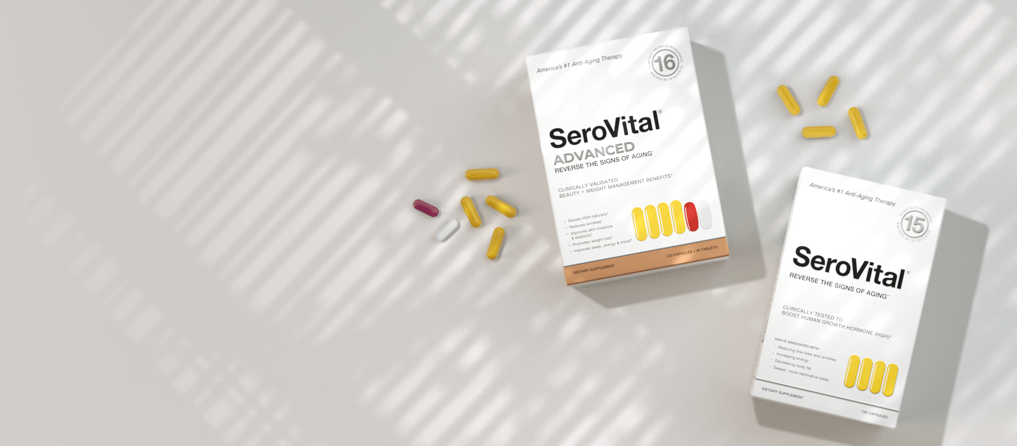 Two white boxes of SeroVital Advanced supplements and scattered capsules (yellow, white, pink) are shown on a light gray surface with window shadow patterns.