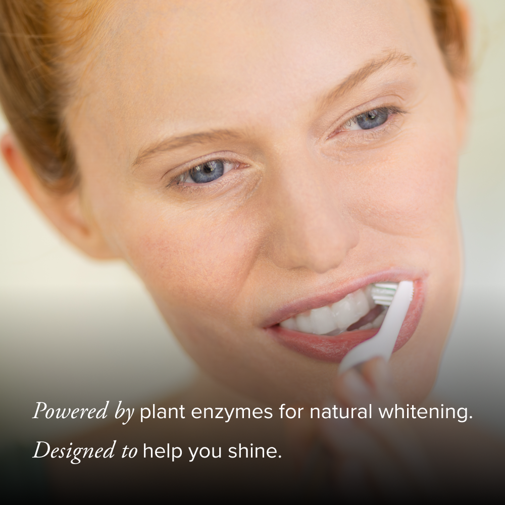 Person brushing teeth with a toothbrush, text about plant enzymes for natural whitening.