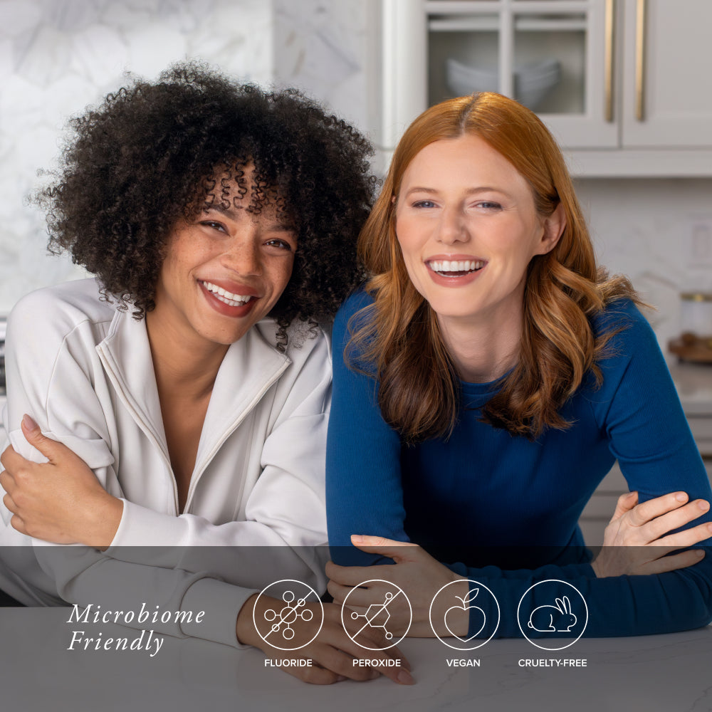 Two women sitting together in a kitchen with icons and text about product features.