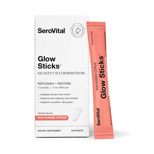 A box of SeroVital Glow Sticks beauty illumination powder for glowing skin with a Sun-Kissed Citrus packet leaning against it