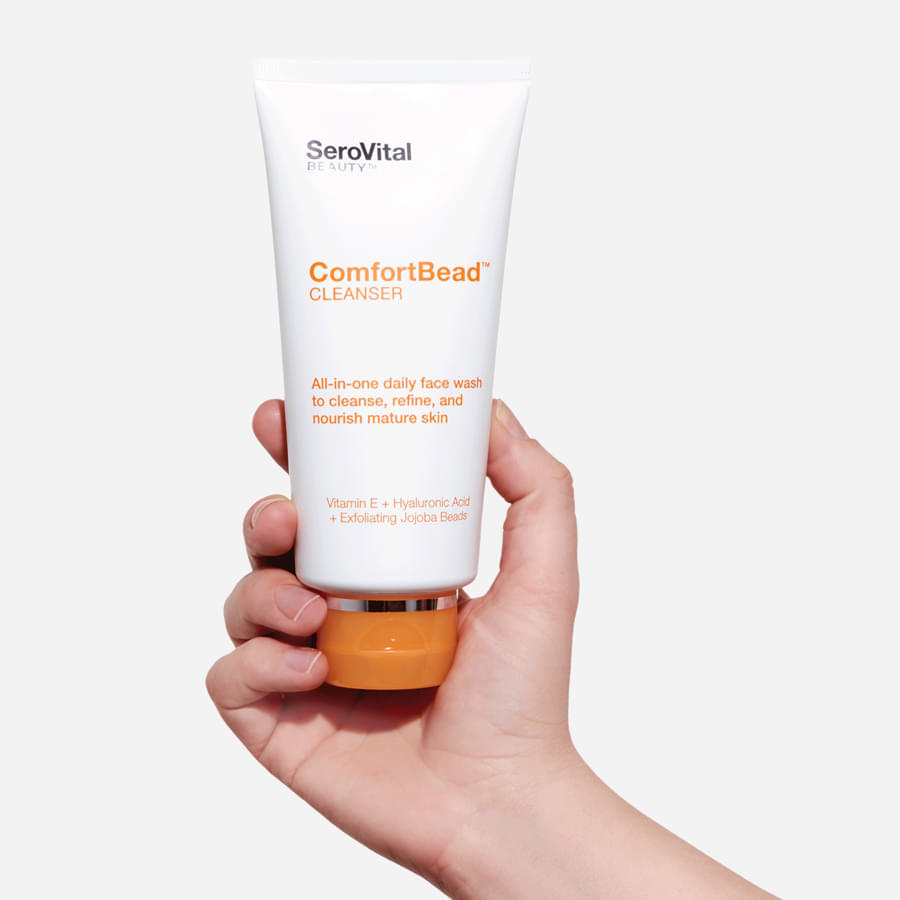 Comfort Bead Cleanser held in hand.