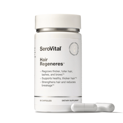 SeroVital Hair Regeneres bottle, a white dietary supplement for regrowing thicker, fuller hair, lashes, and brows. The label lists 60 capsules and key benefits. Two white capsules are shown lying in the foreground