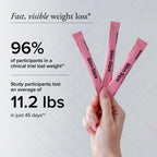 Hand holding Slim Sips packets with weight loss statistics on a light background