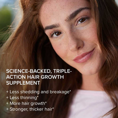 Close-up of a smiling woman with red hair, next to text promoting a science-backed, triple-action hair growth supplement, listing benefits: less shedding and breakage, less thinning, more hair growth, and stronger, thicker hair.