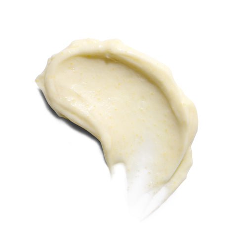 Creamy yellow Serovital ComfortBead Cleanser texture swatch with small exfoliating beads