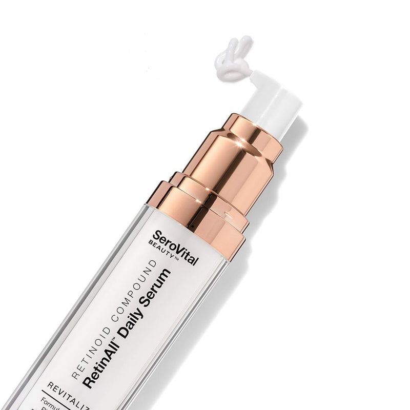  A tube of visible wrinkle reducer RetinAll Daily Serum on a white background with the white serum coming out of the top