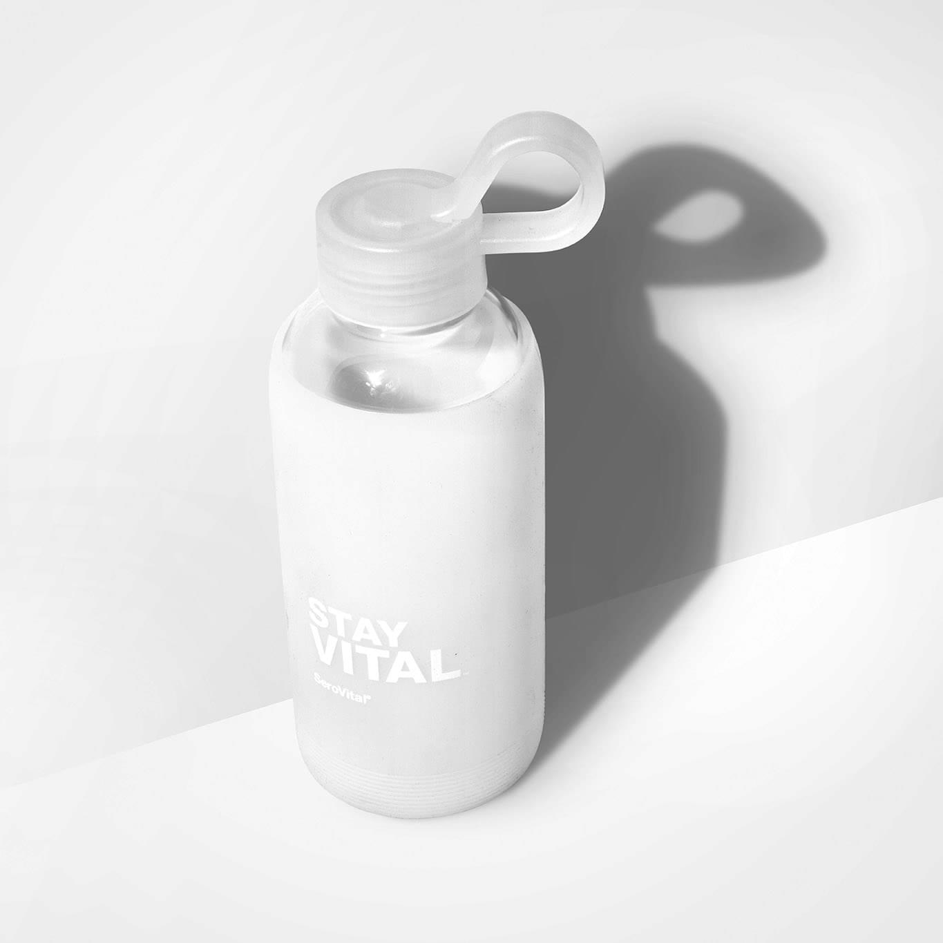 SeroVital glass water bottle with a frosted finish and loop cap
